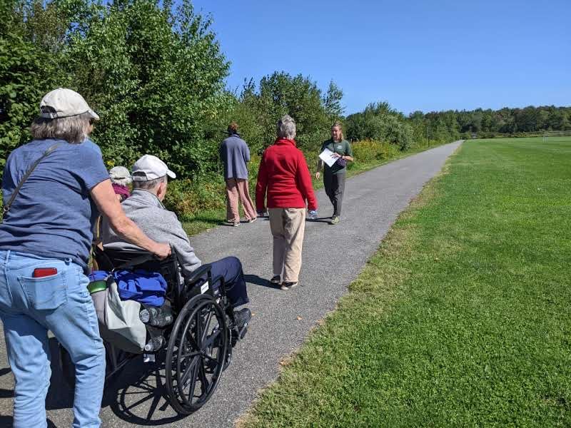 Greenbelt path through Wainwright fields with group of people